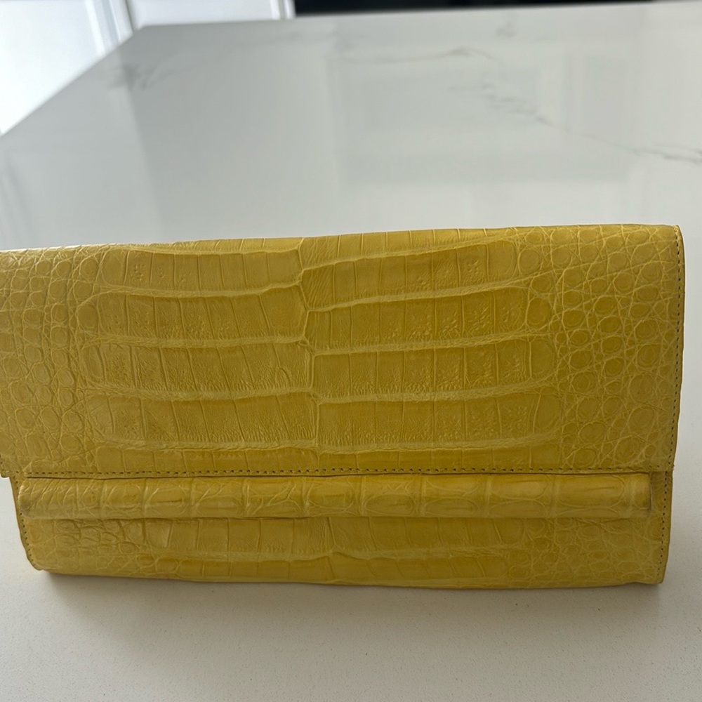 Nancy González crocodile clutch.